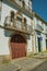 Cute facade of old house and awkward wooden door