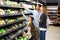 Cute family choosing groceries together