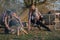 Cute family sitting on a picnic in a forest