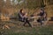 Cute family sitting on a picnic in a forest