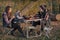 Cute family sitting on a picnic in a forest