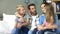 Cute family talking sitting on the couch