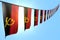 Cute feast flag 3d illustration - many Angola flags or banners hangs diagonal on string on blue sky background with selective