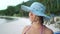Cute Female Person in Blue Sun Hat on Sandy Beach