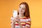 Cute feminine tender young redhead glamour girl holding smartphone taking pictures summer urban vibes female blogger