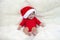 Cute five months asian baby smiling with santa hat on bright soft carpet.