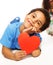Cute five years old boy with heart symbol