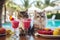 Cute fluffy cats drinking cold summer cocktails and relaxed by the pool. Summer holidays