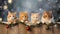 Cute fluffy cats peek out from the table in New Year\\\'s hats, festive garlands and bokeh on the image