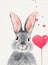 A cute fluffy grey rabbit with pink ears and hearts