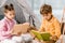 cute focused children sitting on carpet and