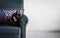 Cute french bulldog on grey armchair