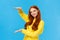 Cute friendly-looking caucasian redhead woman shaping large object with hands, presenting gift, product advertising over