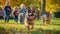 Cute funny German Shepherd group running and playing on green grass with kids background in park in autum, Generative AI