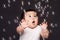 Cute funny happy amazed baby with bubbles
