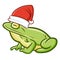 Cute and funny realistic frog wearing Santa`s hat for Christmas