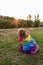 Cute funny spanish brown water dog with a colorful rainbow gay flag. Pride festivity concept. lifestyle outdoors