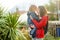 Cute funny toddler boy in his mothers arms. Mom and son having fun on sunny spring day in a park. Adorable son being held by his