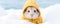 Cute funny white hamster dressed in yellow jacket sitting on snow on blurred winter background.