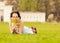 Cute and funny young female hiding behind book