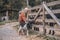 A cute gilr stroking a small goatling