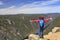 Cute girl admiring the landscape of Malbaie Canyon in Quebec, Canada