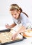 Cute girl baking cookies