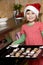 Cute girl baking xmas cookies