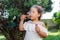 Cute girl blowing soap bubbles