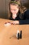 Cute girl chooses color for nail polishing