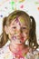 Cute girl covered in paint