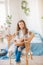 Cute girl with easter bunnies in the room decorative for holiday. Easter mood