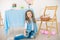 Cute girl with easter bunnies in the room decorative for holiday. Easter mood