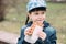 Cute girl eating waffle in the yard