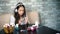 Cute girl in headphones listening music making manicure polishing nails with free and copy space