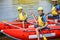 Cute girl in helmet and live vest with paddle ready for rafting on the catamaran