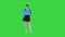 Cute girl holding empty board announcing or presenting something on a Green Screen, Blue mockup.
