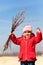 Cute girl holding willow flowers in her hands