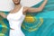 Cute girl holds Kazakhstan flag in hands behind her back on the white background - flag concept 3d illustration