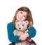 Cute girl hugging teddy bear