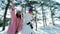 Cute girl making photo with a snowman, winter selfie, mobile phone in hand of a young woman making fun selfie photo in