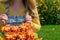 Cute girl in overalls with a bouquet of flowers