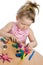 Cute girl playing with color play plasticine
