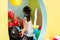 Cute girl playing with colorful balloons during playtime at the kindergarten