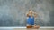 Cute girl practicing yoga in the Studio, sitting in the Lotus position concentrating