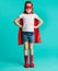 Cute girl in red superhero costume