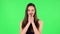 Cute girl smiles and showing blowing kiss. Green screen