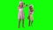 Cute girls with Santa hats waving hands looking at camera. Chroma key