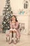 Cute and gorgeous. Happy Christmas girl. Little girl with xmas look. Small girl at Christmas tree. Baby girl smile in