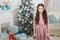 Cute and gorgeous. Happy Christmas girl. Little girl with xmas look. Small girl at Christmas tree. New year eve. Holiday